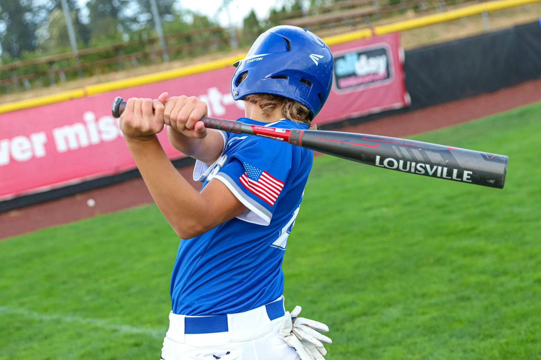 Youth baseball player practicing a swing